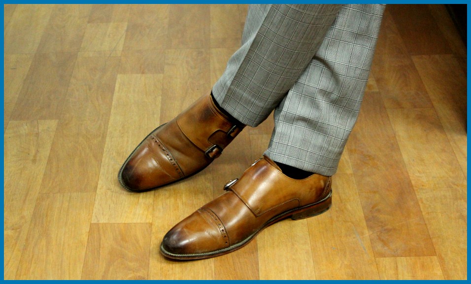 A man wearing double monk strap shoes