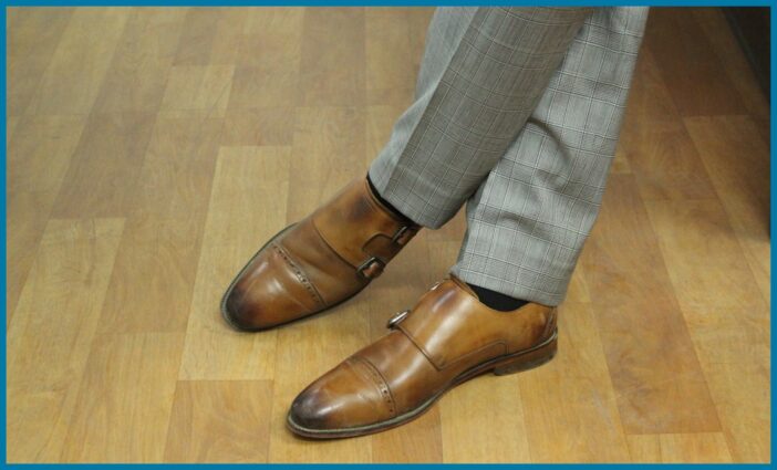 A man wears double monk strap shoes