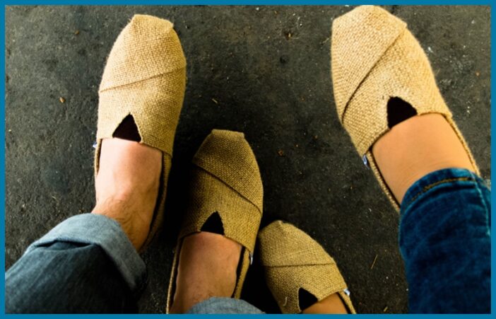 A couple wearing toms alternative shoes
